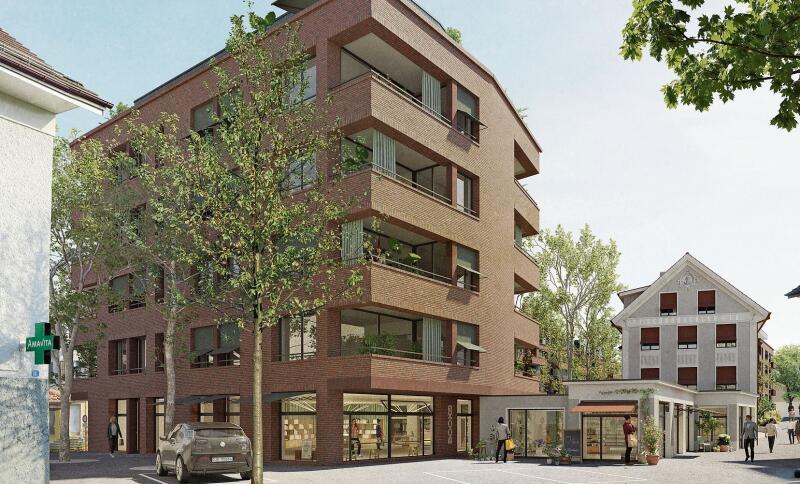 Blick von der Oberen Bahnhofstrasse auf den geplanten Neubau und das Schönbächlerhaus (rechts). (Visualisierung zvg.)
